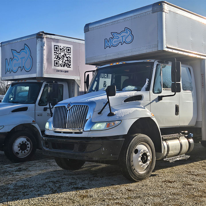 a truck is parked in front of a car