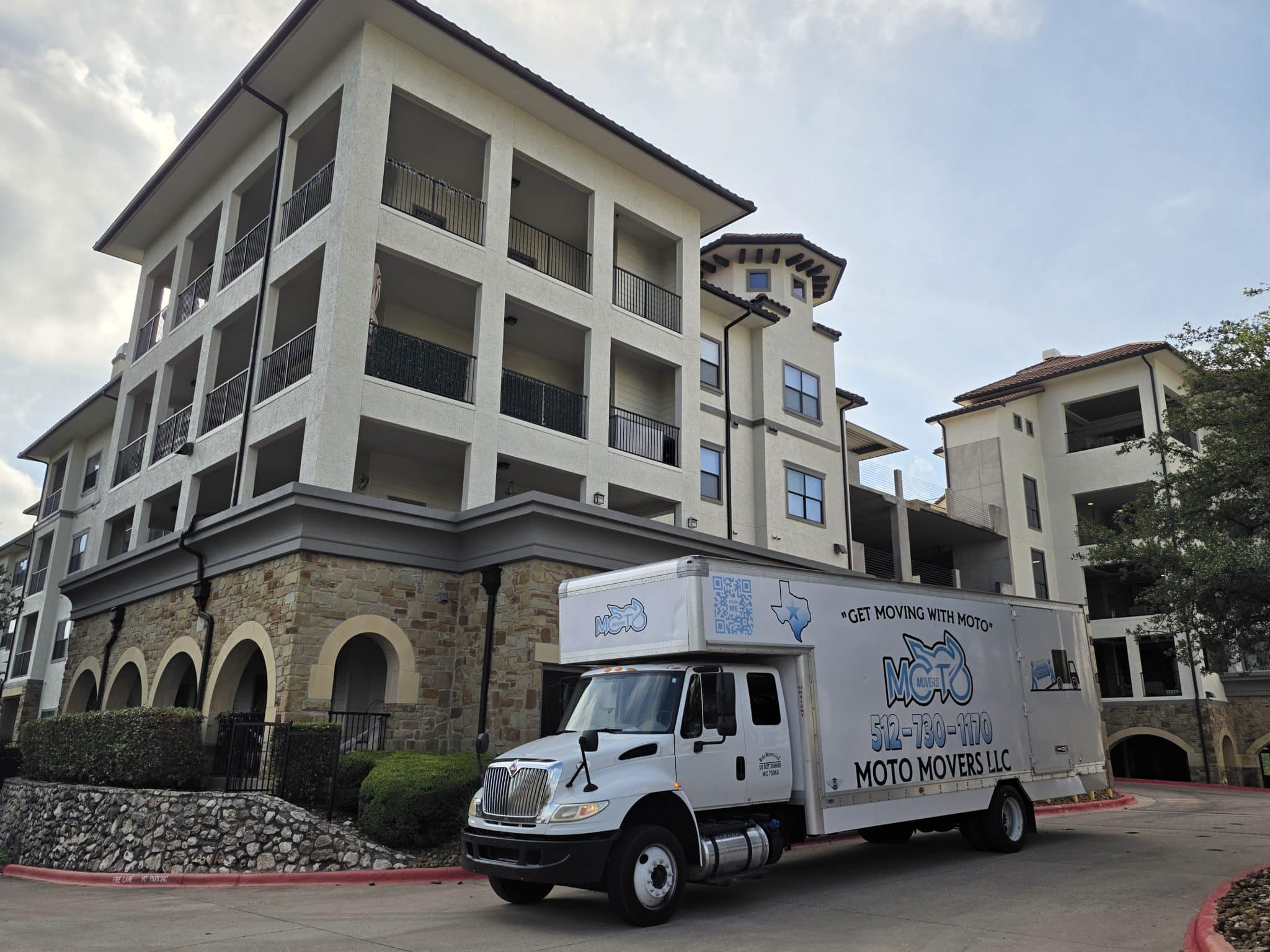 Moto Movers Moving truck loading up at Lavella Luxury Apartments of hillside west Austin, Texas.