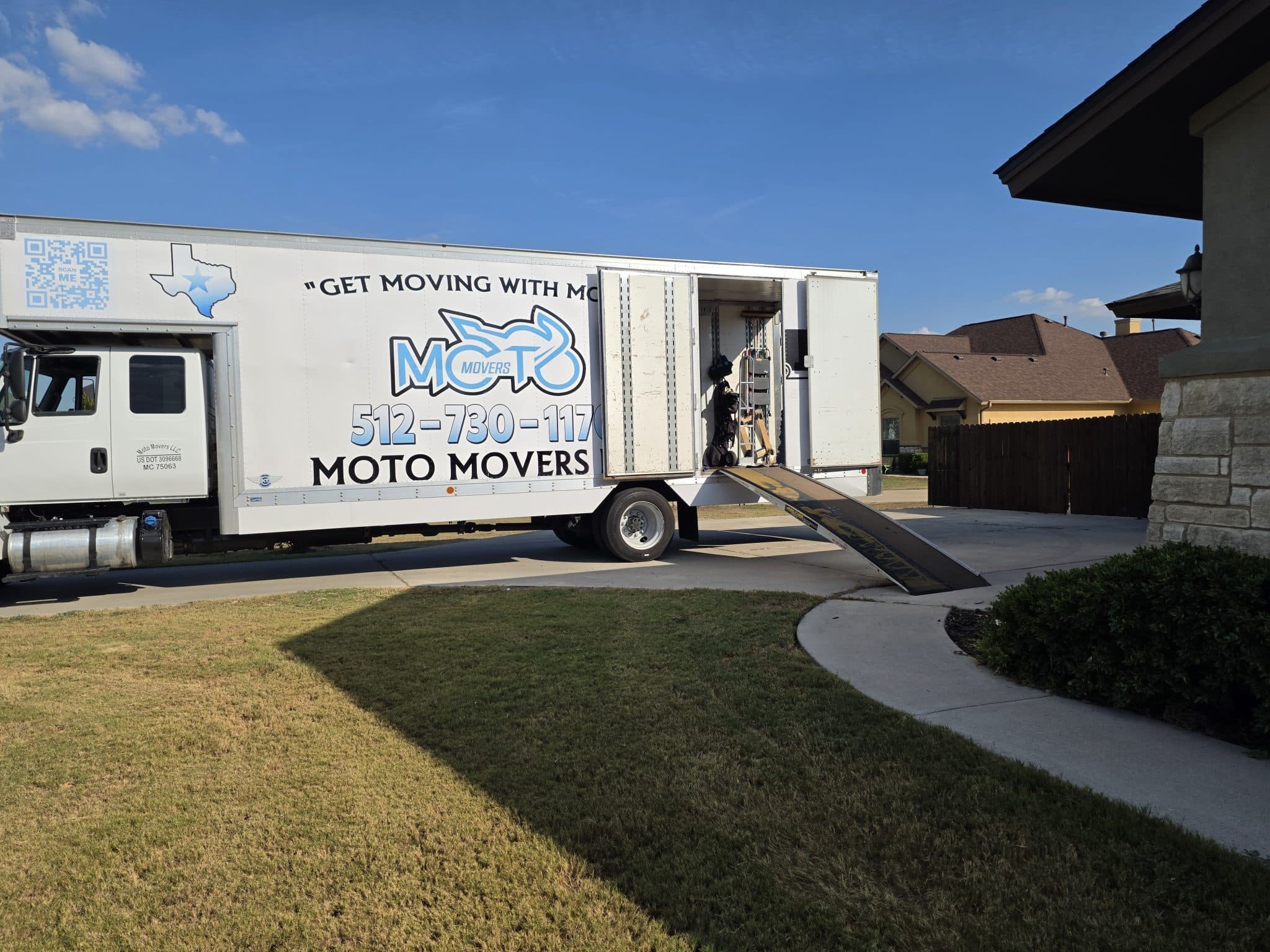 Moto Movers moving large home Moving truck from Moto Movers unloading at a large home in Hutto, Texas.